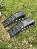 Top view of both steel automotive ramps showing perforated surfaces