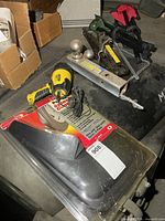 Stanley spotlight, splash guards package, dual hitch ball, scissor jack and stools partially visible