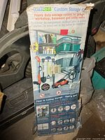 Full view of retail box showing product name, images of assembled storage system and box wear