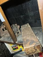 Shelf with pipe vise, threader parts, Armstrong box
