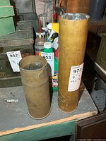 Both brass shell casings standing