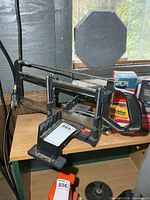 Overall view of Jobmate manual miter saw on bench