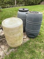 Overall view of three rain barrels outdoors