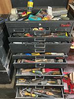 Front view of Torin toolbox with drawers open showing assorted tools