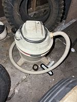 Top view of Craftsman wet-dry vacuum with hose and attachments on floor