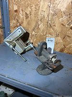 Overall view of vise and pinking machine on shelf
