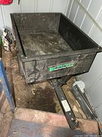 Overall view of trailer showing hitch tongue and logo