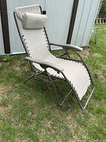 Full view of beige zero gravity chair outdoors