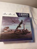 Front of sealed 1000-piece Bei Bi La puzzle box showing lighthouse illustration