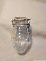 Full view of jar showing shape and closure mechanism