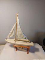 Full view of model sailboat on stand