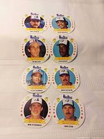 Eight round Hostess 1988 MLB card discs laid out showing all player fronts