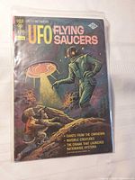 Front cover of Gold Key UFO Flying Saucers comic in bag