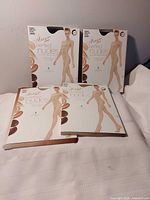 Four sealed Hanes Perfect Nudes pantyhose packages