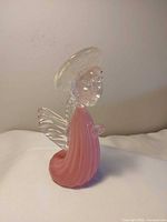 Full view of glass angel showing pink body, clear wings, head and halo