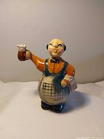 Front view of figural porcelain pitcher