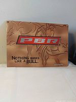 Front of PBR metal tin sign showing logo and slogan