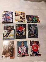 Overall view of all nine hockey cards laid out in three-by-three grid