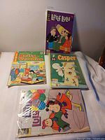 Four comics laid out showing covers
