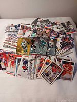 Overview of large spread of NHL cards assorted by team and brand