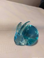 Front view of blue glass bunny figurine