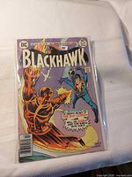 Front cover of DC Blackhawk #248 in bag and board