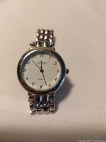 Front view of Geneva wristwatch showing dial and bracelet