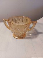 Front view showing twin handles, iris pattern and ribbed texture