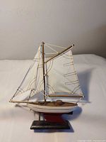 Full view of model sailboat on stand