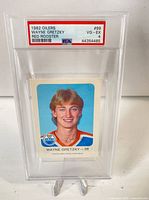 Front of PSA-encapsulated 1982 Red Rooster Wayne Gretzky card showing grade label and portrait