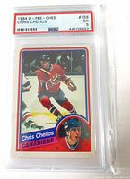 Front of encapsulated Chris Chelios rookie card showing PSA label and card front