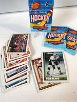 Stack of loose cards, Rob Blake Super Rookie, three sealed packs front view