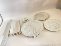 All ten porcelain serving pieces grouped
