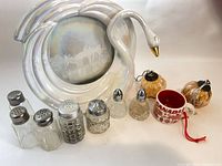 Group shot showing all items: swan frame, six shakers, shot cup, two pumpkin ornaments