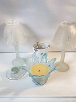 All five holders and two candles group shot