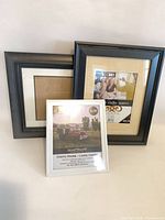 Front view of three frames: two black 11x14 and one white 8x10