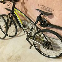 Full view of bike with fenders, bottle cage and cable lock visible
