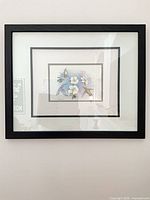 Full view of framed print on wall