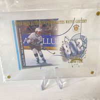 Front of Wayne Gretzky Upper Deck limited edition card in acrylic holder, serial 01898/10000 visible