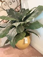 Full view of faux plant with pot