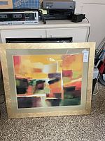 Front view of framed abstract print showing full artwork and frame
