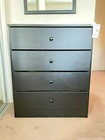 Full front view showing four drawers and overall condition