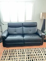 front view of black leather power recliner sofa