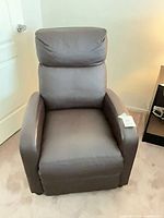 Front view of brown faux leather recliner chair