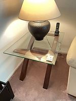 Full view of table with glass top and wood base