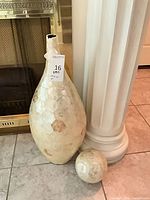 vase and sphere beside column showing overall appearance