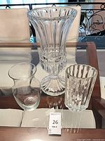 All three clear vases displayed together