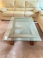 Top view showing rectangular clear glass surface and wood base structure