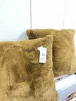Front view both faux fur pillows showing color and texture