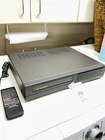 VCR with remote control top and front view